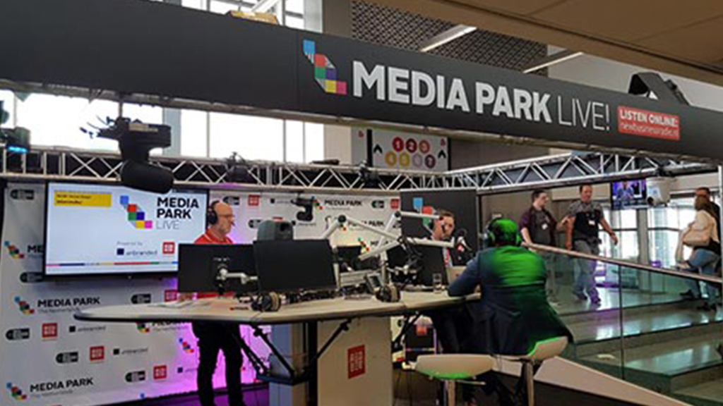 A desk of monitors at the Media Park Live event.