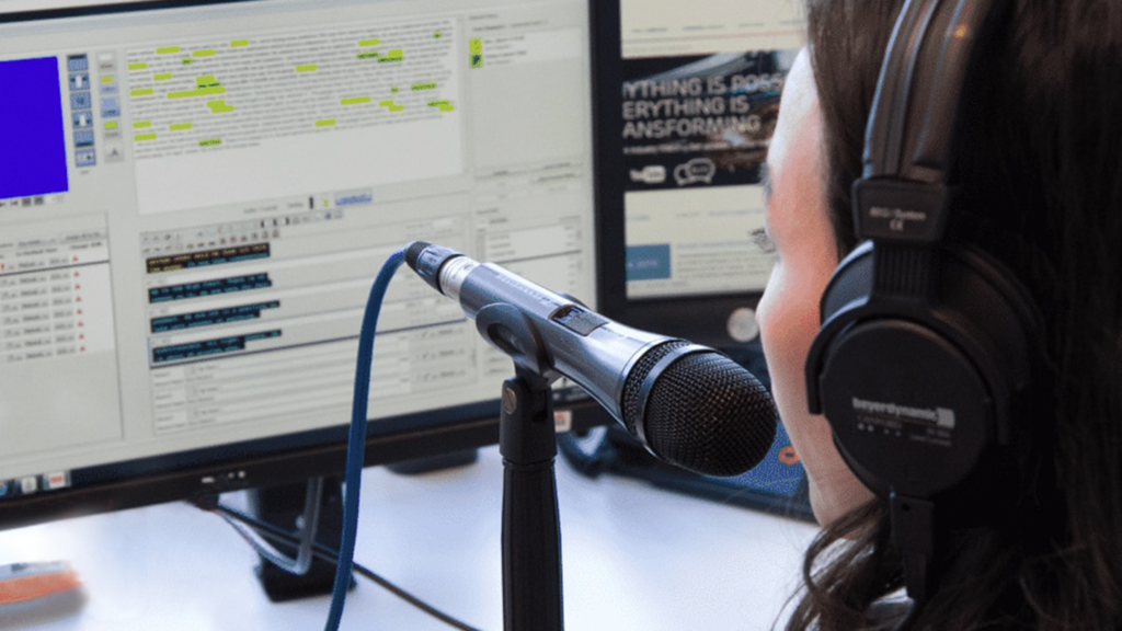A woman creating subtitles through respeaking.