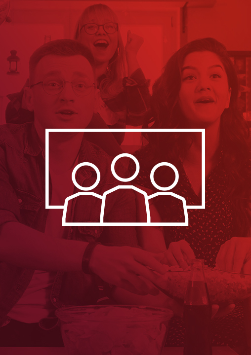 A icon of three people in front of a screen. The icon is set against a red-tinged background featuring three people watching something with bowls of snacks in front of them.