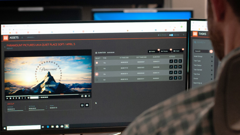 The Paramount logo on a computer monitor alongside a list of timecodes.