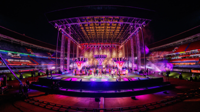A show on a stage in the centre of a stadium.
