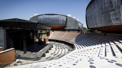 An outdoor auditorium facing a stage.