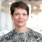 Dara Urquhart, COO A smiling woman with hazel eyes and short, brown hair and a fringe.