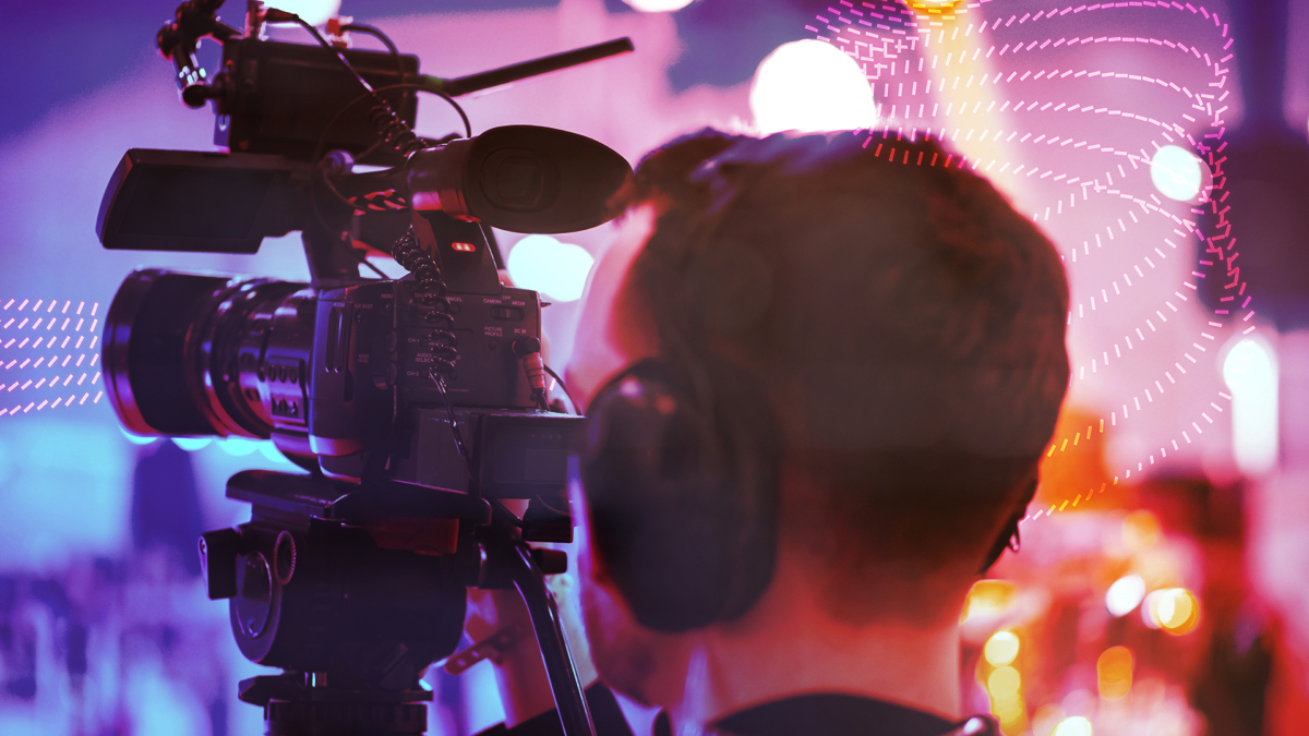 Six pink, dotted lines snaking past a camera operator.