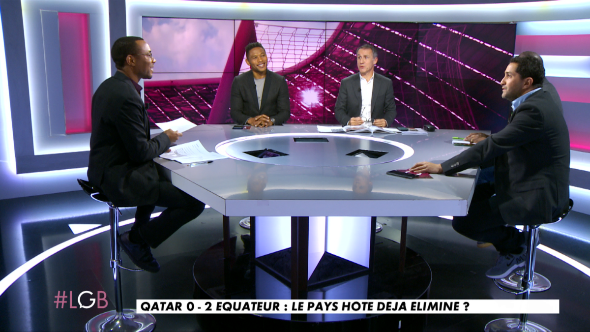 A screenshot from the French sports programme Les Grandes Bouches showing five men sitting around a table in a studio.