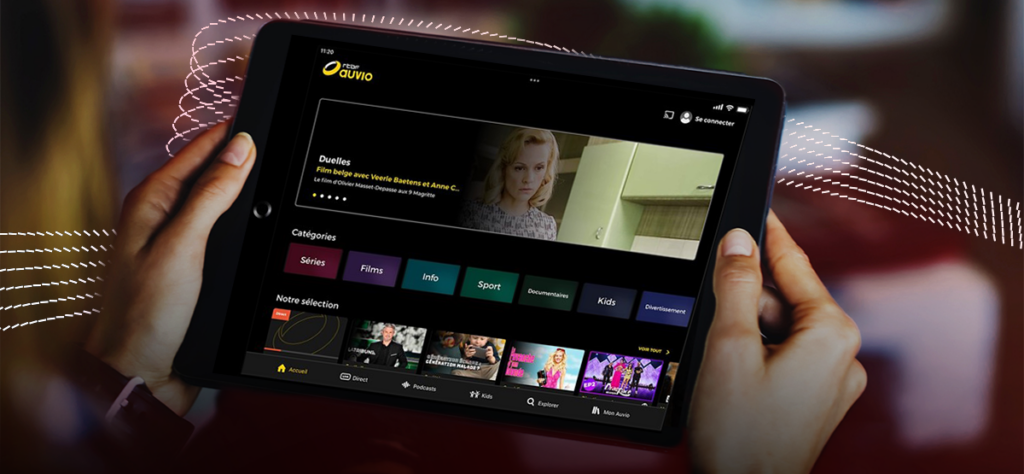 Six pink-and-white, dotted lines moving behind a tablet device displaying the streaming service Auvio.