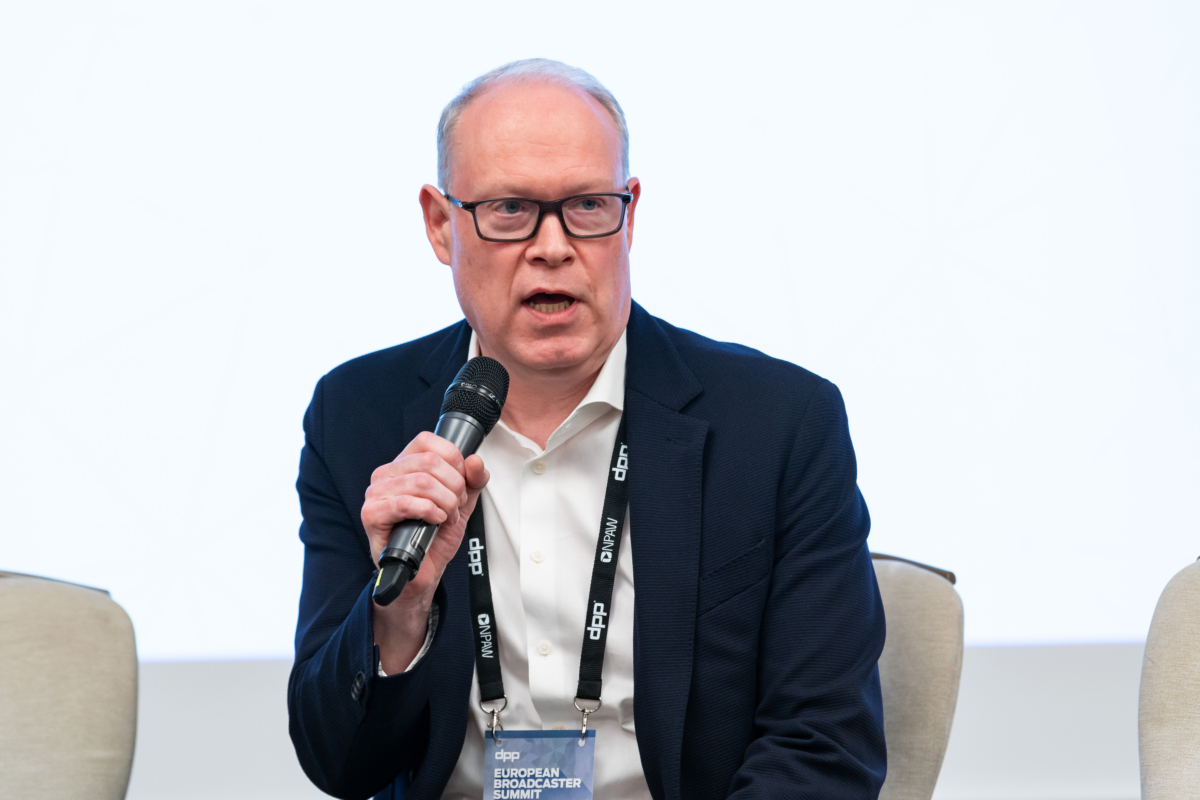 Red Bee Media's CEO James Arnold opening the ceremony  James Arnold speaking into a microphone.