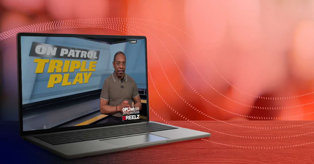 A Reelz live stream on a laptop screen.