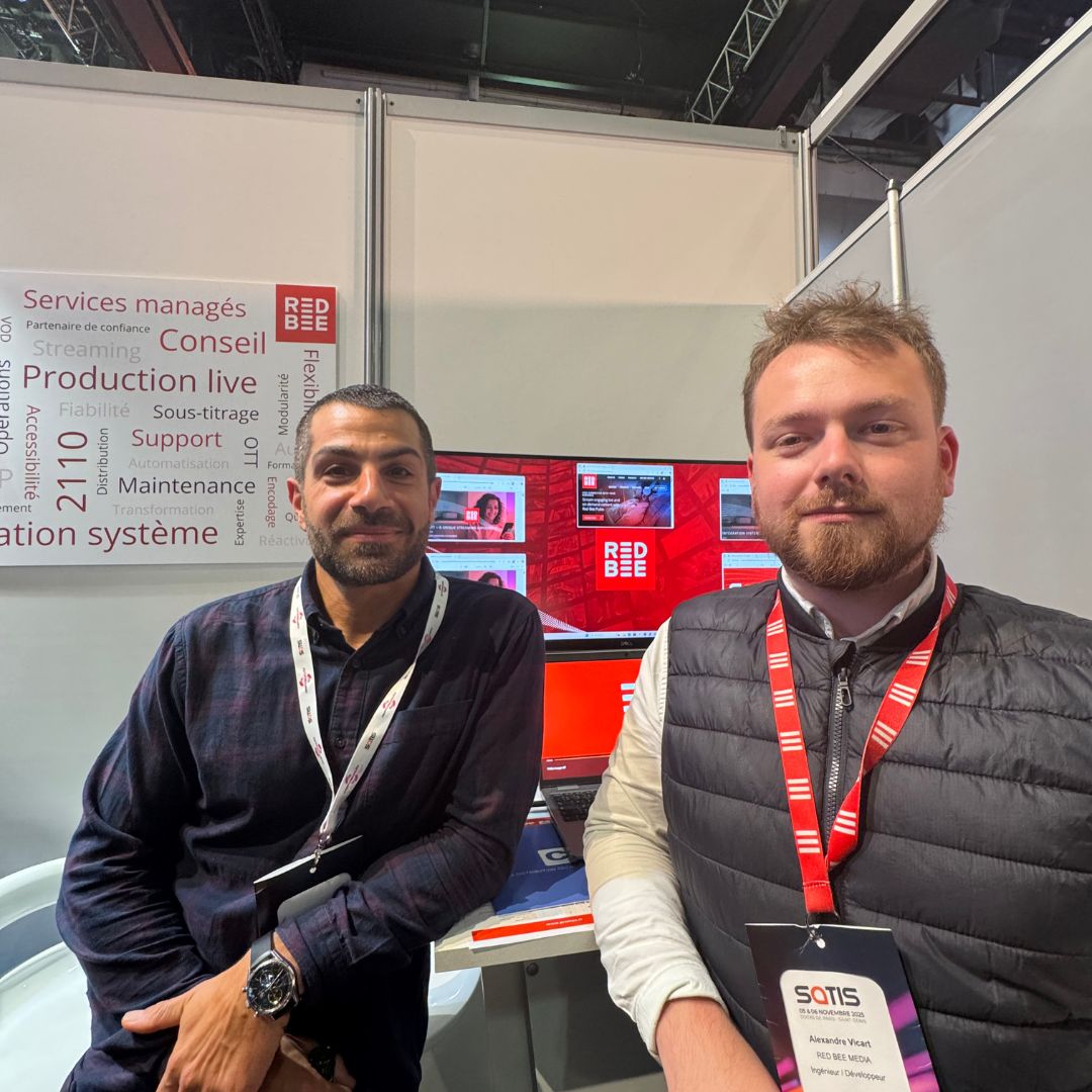 Two men sitting at a meeting room in a conference